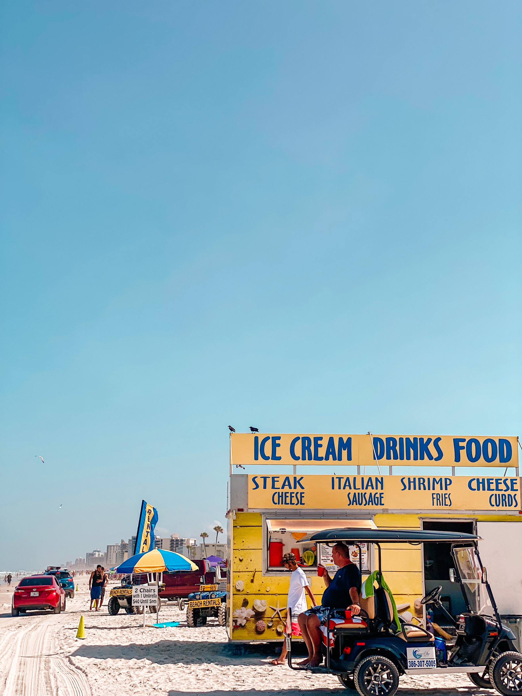 Foodtruck and Vehicles on a Beach 